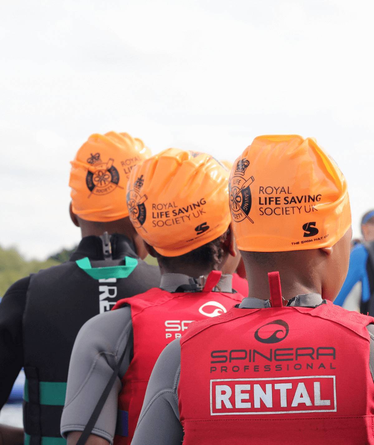 3 people with Royal Life Saving Society hats