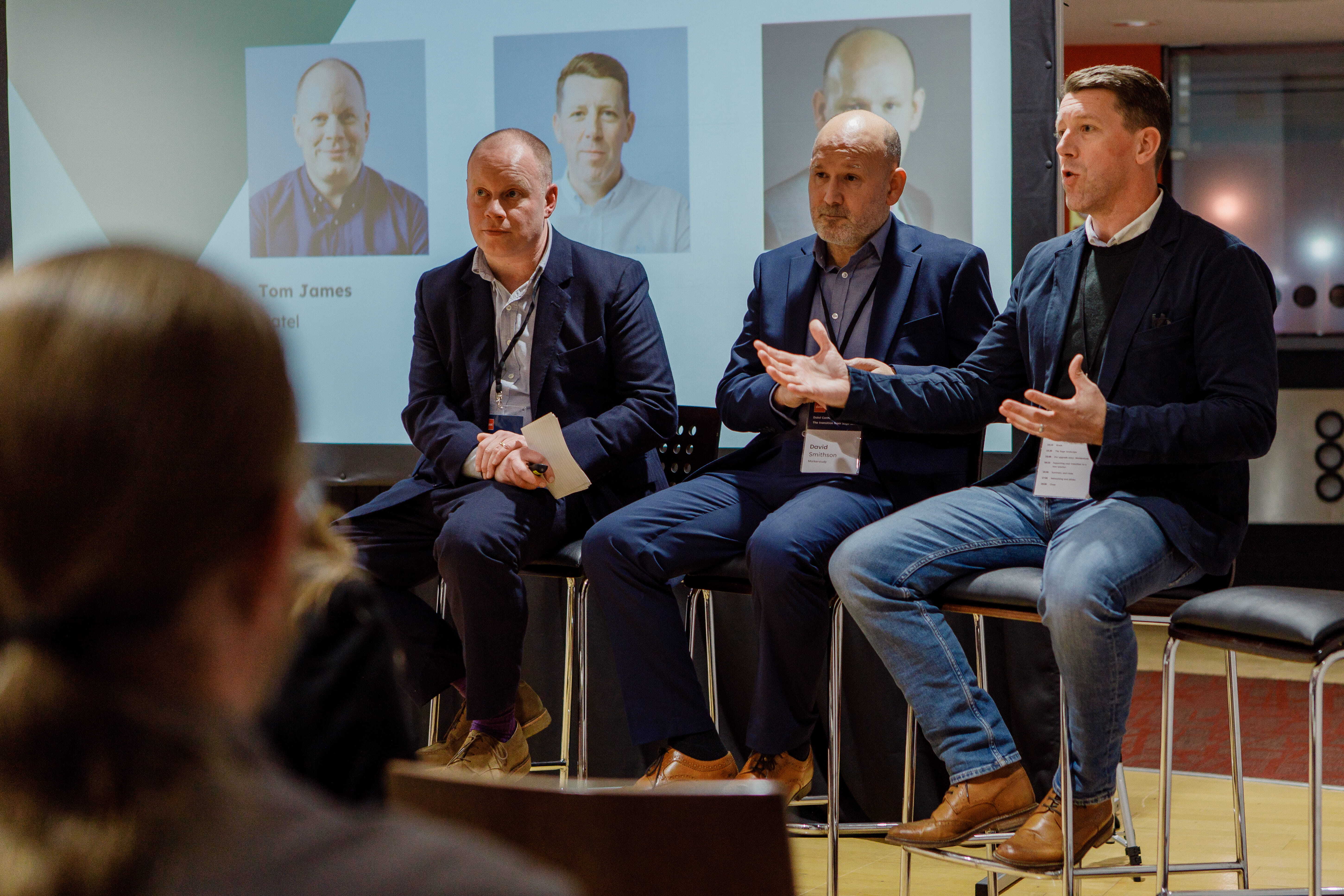 Four panellists sat on the stage at an event
