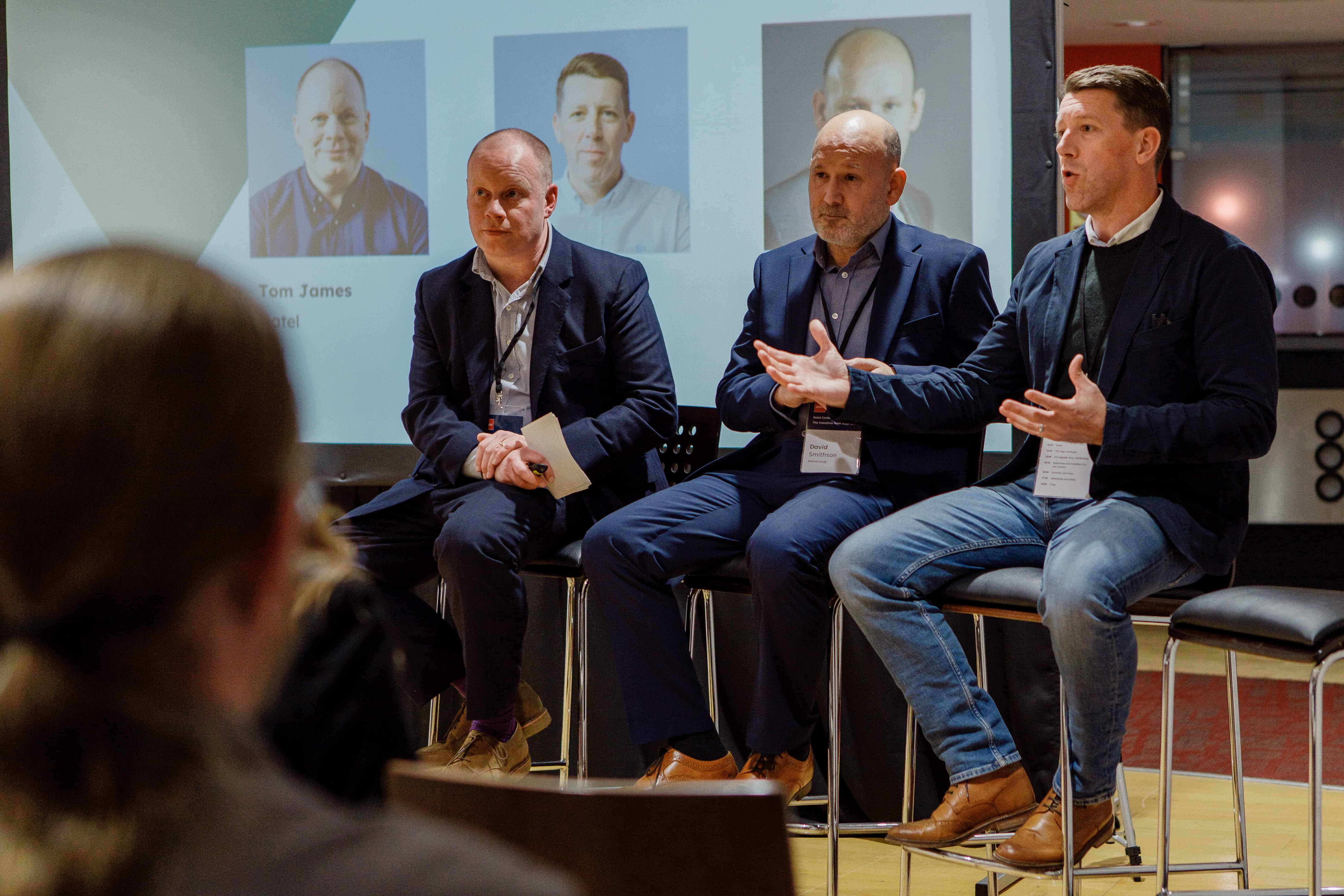 Four panellists sat on the stage at an event